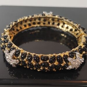 Kenneth Jay Lane Bangle Bracelet featuring black cabochons and crystal starfish